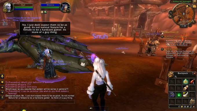 Still of World of Warcraft with a characters on an orange background with black speech bubble