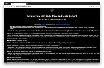 Screenshot of black webpage with white text in an interview format. The header has a circular web like symbol and the title is lined by broken white lines.