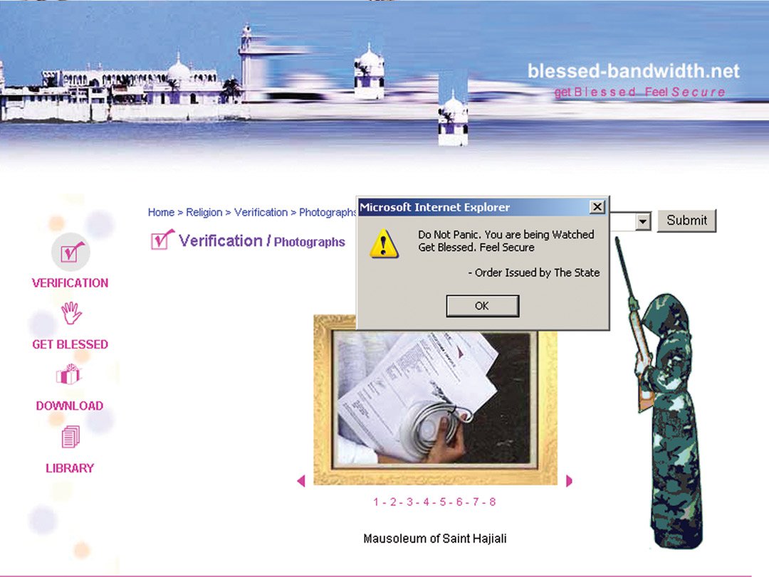 A screenshot of a verification page with a Hindu temple image distorted as the header. A golden frame shows a person holding papers and a wire. A person in a hooded army gown holds a rifle. A pop up window tells the viewer to not panic as they watched.