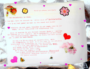 A letter in red typewriter text with flower, heart, butterfly, bee, and fruit stickers scattered throughout.