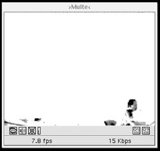 Vintage GUI of a media player showing a low resolution image of a very far away person working diligently at their desk.