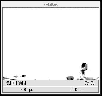 Vintage GUI of a media player showing a low resolution image of a very far away person working diligently at their desk.