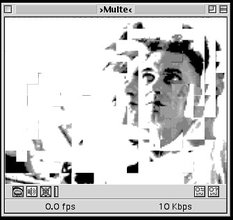 Vintage GUI of a media player showing a glitched image of a man's face, distorted and facial features exacerbated by the pixels scattered.