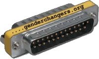 Metal hardware with a yellow label of "genderchangers.org" typed on the edge of the silver board. Two rows of 25 thin plugs are caved in by a block that extends out of the front and back of the board.