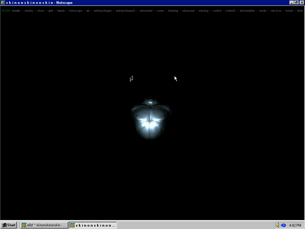 Screenshot of vintage Microsoft webpage with a black window and a metallic torso, showing the chest abdominals, and half of the neck, brightly lit by a light, and all the other body parts fading into the shadows of darkness.