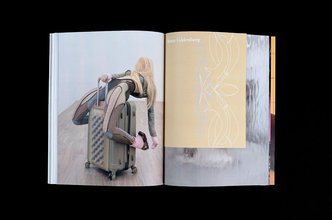 spread from Snail magazine, the left hand side shows a sculpture of a blond woman riding a roller suitcase